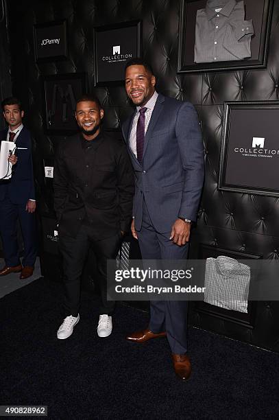 Singer songwriter Usher and TV personality Michael Strahan attend JCPenney and Michael Strahan's launch of Collection by Michael Strahan on September...