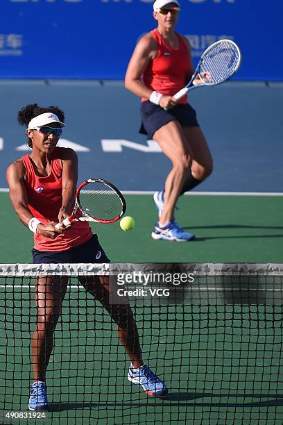 Raquel Kops-Jones and Abigail Spears of the United States compete against Martina Hingis of Switzerland and Sania Mirza of India in quarter-finals...