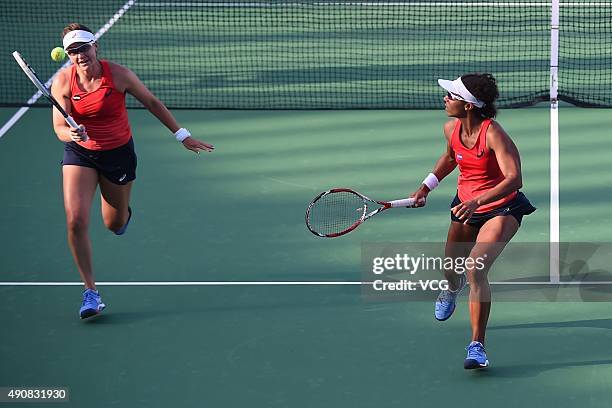 Raquel Kops-Jones and Abigail Spears of the United States compete against Martina Hingis of Switzerland and Sania Mirza of India in quarter-finals...