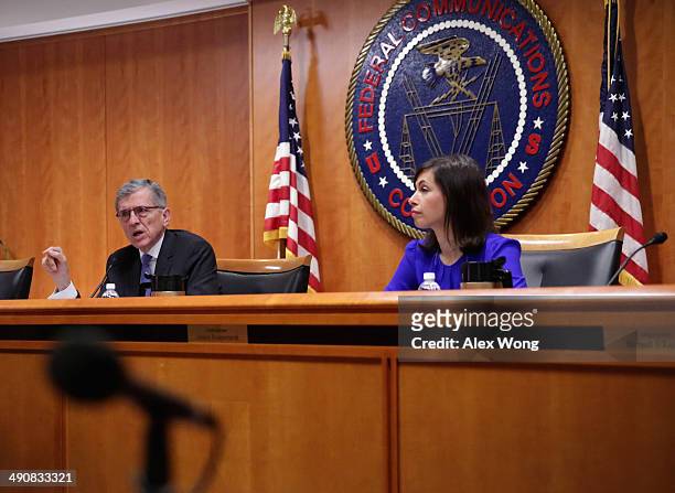 Federal Communications Commission Chairman Tom Wheeler speaks as commissioner Jessica Rosenworcel listens during an open meeting to receive public...