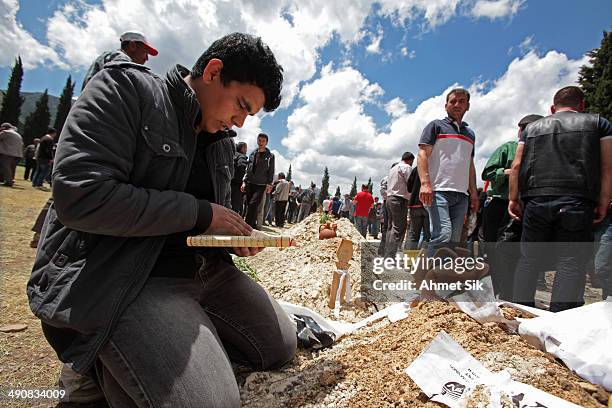 Relatives read the holy Kur'an during a funeral for the victims of a mining disaster on May 15, 2014 in Soma, a district in Turkey's western province...