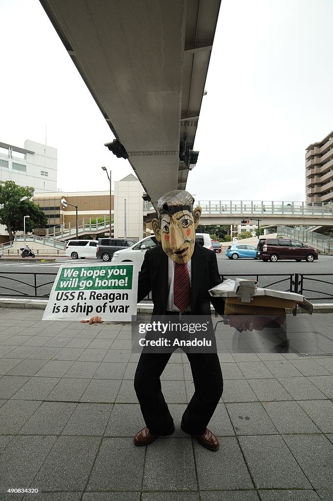 Local residents protest against the USS Ronald Reagan in Japan