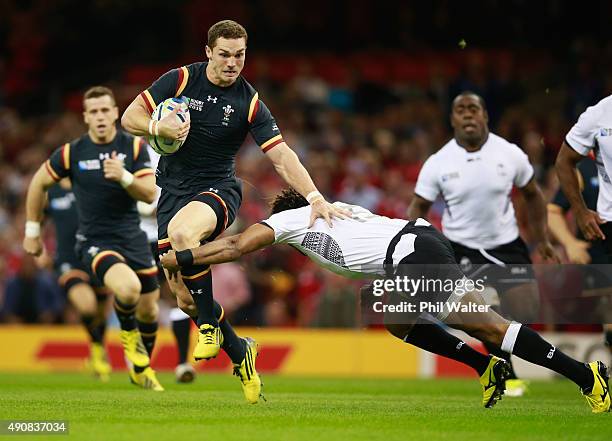 Metuisela Talebula of Fiji tries to tackle George North of Wales during the 2015 Rugby World Cup Pool A match between Wales and Fiji at the...