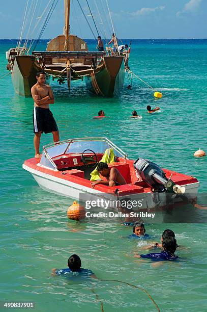 children playing in avarua harbour - cook islands stock pictures, royalty-free photos & images