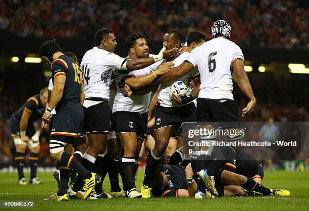 Vereniki Goneva of Fiji celebrates with his team-mates after scoring their first try during the 2015 Rugby World Cup Pool A match between Wales and...