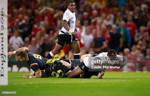 Vereniki Goneva of Fiji scores their first try during the 2015 Rugby World Cup Pool A match between Wales and Fiji at the Millennium Stadium on...