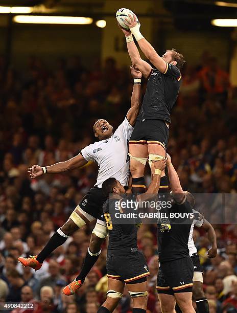 Wales' lock Alun Wyn Jones catches the ball in a line out against Fiji's lock Leone Nakarawa during a Pool A match of the 2015 Rugby World Cup...