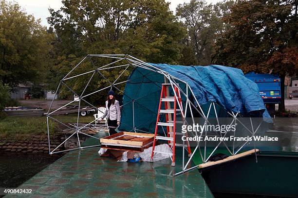 Artist Mary Mattingly works on her floating installation "Torus" at Toronto Island Hanlan's Point, September 29, 2015. Mattingly's floating Nuit...