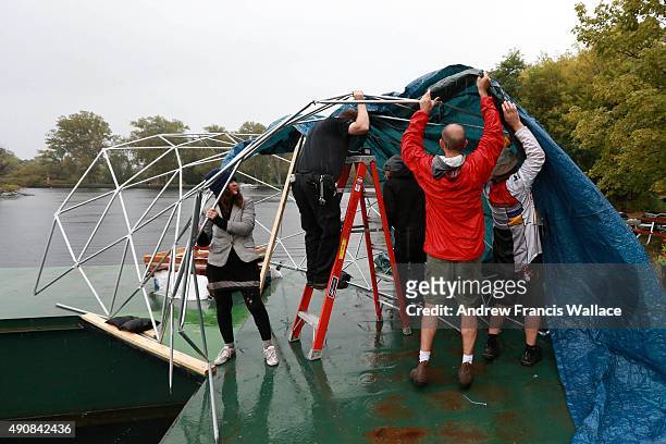 Artist Mary Mattingly works with her crew on her floating installation "Torus" at Toronto Island Hanlan's Point, September 29, 2015. Mattingly's...