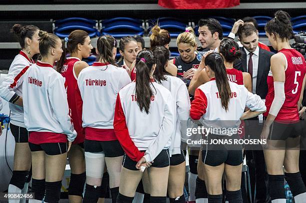 Turkey's head coach Akbas Ferhat addresses his players during the Women's EuroVolley 2015 quarterfinal match between Germany and Turkey in Antwerp,...