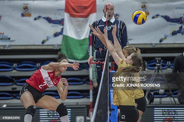 Turkeys Kirdar Gozde spikes the ball in front of Silge Wiebke of germany during the Women's EuroVolley 2015 quarterfinal match between Germany and...