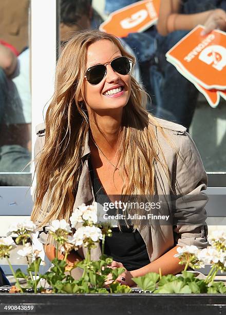 Ester Satorova watches Tomas Berdych of Czech Republic in action in his match against Grigor Dimitrov of Bulgaria during day five of the...