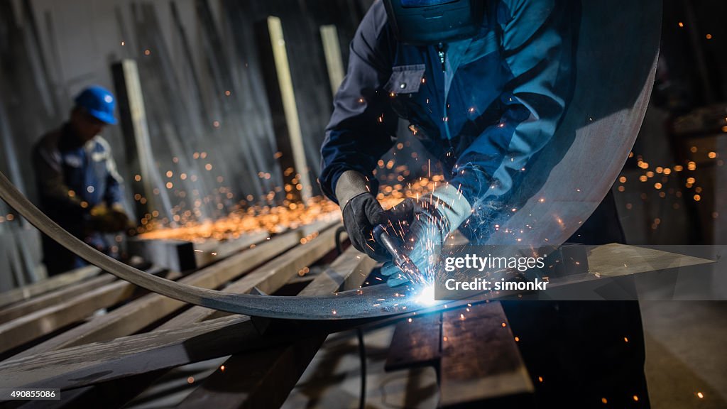 Welder working in workshop