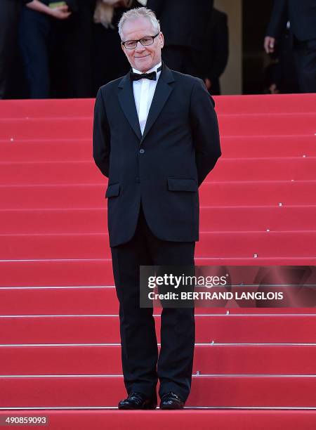 The General Delegate of the Cannes Film Festival Thierry Fremaux looks at guests arriving for the screening of the film "Mr. Turner" at the 67th...