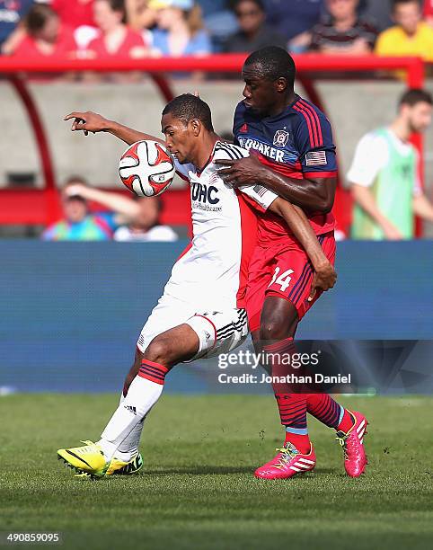 Jhon Kennedy Hurtado of the Chicago Fire and Jerry Bengtson of the New England Revolution battle for the ball during an MLS match at Toyota Park on...