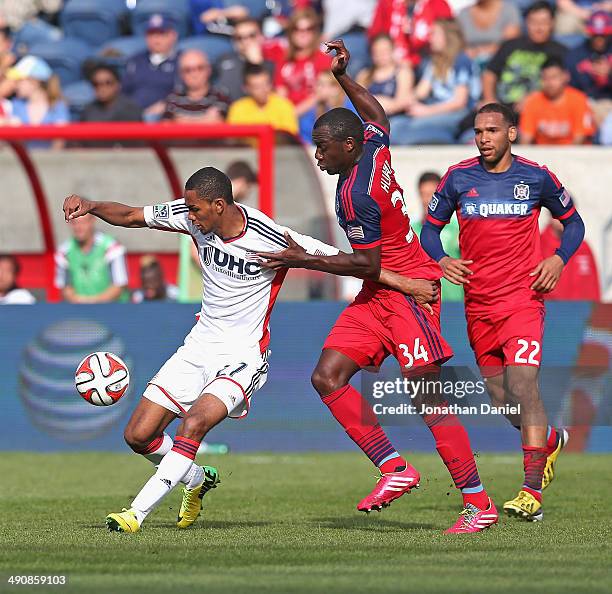 Jhon Kennedy Hurtado of the Chicago Fire and Jerry Bengtson of the New England Revolution battle for the ball during an MLS match at Toyota Park on...