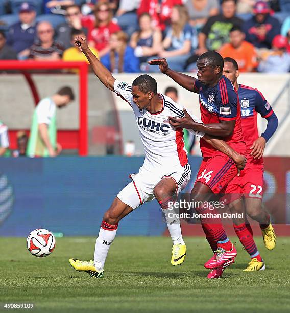 Jhon Kennedy Hurtado of the Chicago Fire and Jerry Bengtson of the New England Revolution battle for the ball during an MLS match at Toyota Park on...