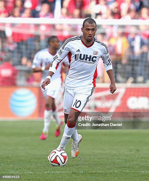 Teal Bunbury of the New England Revolution advances the ball against the Chicago Fire at Toyota Park on April19, 2014 in Bridgeview, Illinois. The...