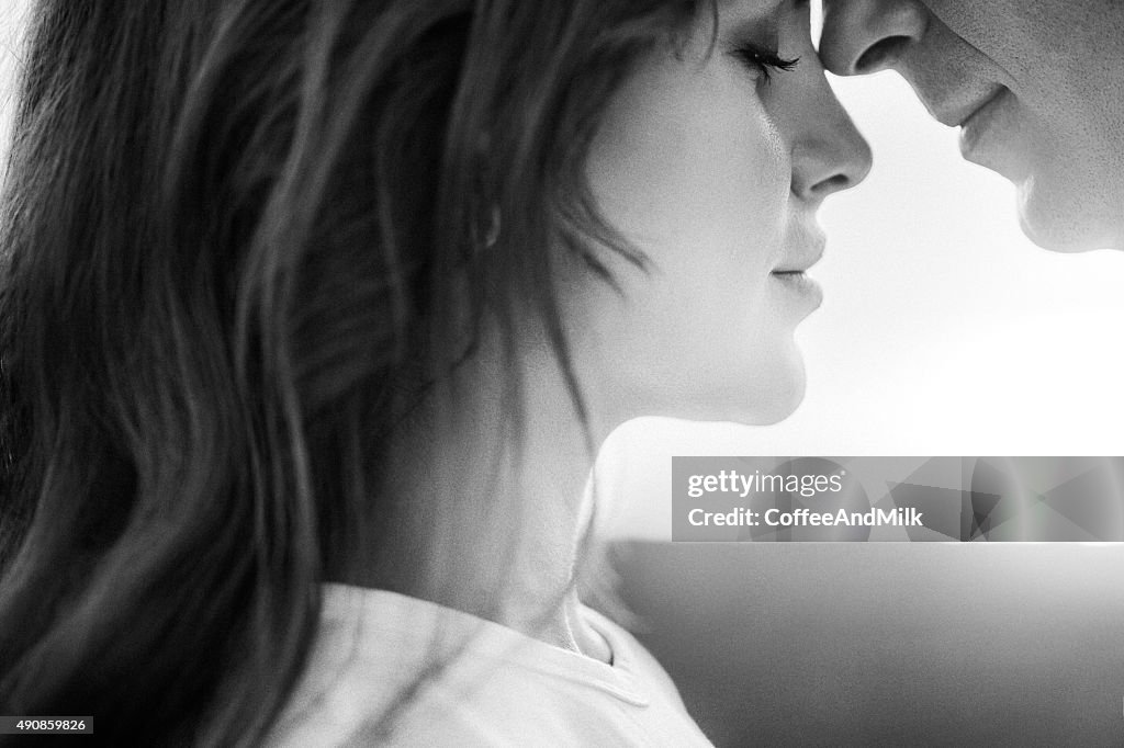 Two people embracing on the background of sea coast