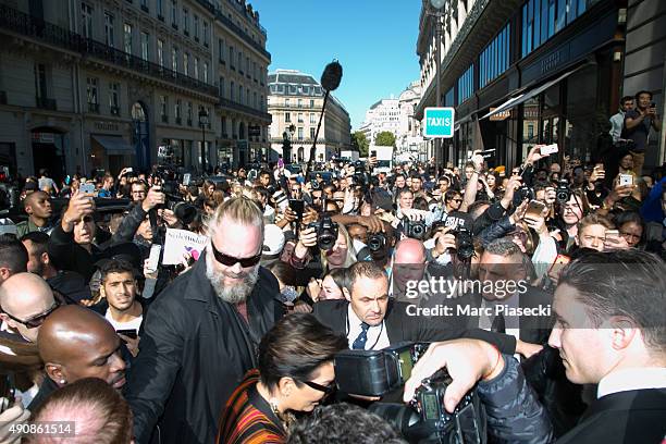 Kris Jenner is surrounded by the crowd as she arrives to attend the 'BALMAIN' fashion show during the RTW Paris Fashion Week on October 1, 2015 in...