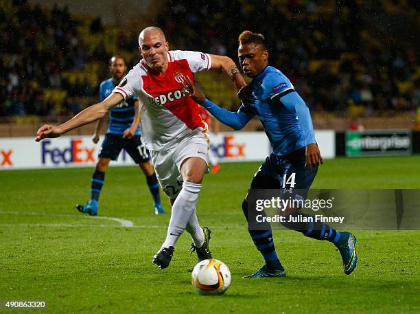 Andrea Raggi of Monaco and Clinton N'Jie of Tottenham Hotspur tussle for the ball during the UEFA Europa League group J match between AS Monaco FC...