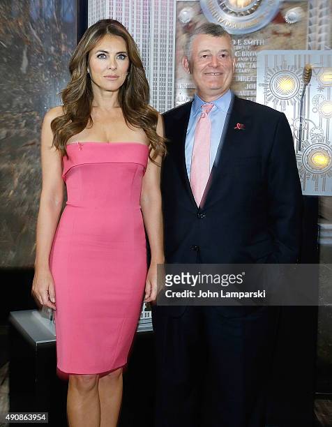 Elizabeth Hurley and William P. Lauder light the Empire State Building Pink at The Empire State Building on October 1, 2015 in New York City.