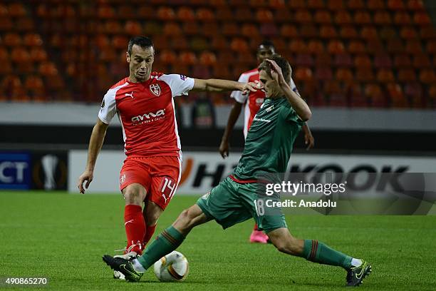 Aleksandr Kolomeytsev of Lokomotiv Moscow is in action against Hamdi Salihi of Skenderbeu during the UEFA Europa League match between Lokomotiv...