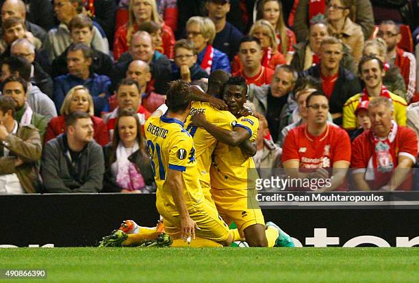 Ebenezer Assifuah of FC Sion celebrates scoring their first goal with team mates during the UEFA Europa League group B match between Liverpool FC and...