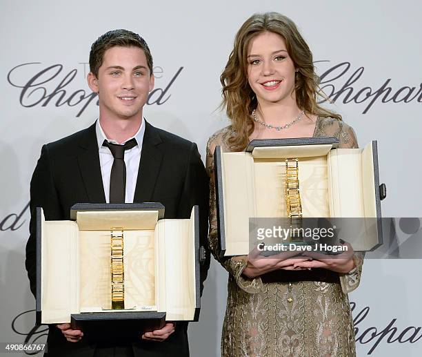 Actors Logan Lerman and Adele Exarchopoulos accept awards onstage at the Chopard Trophy during the 67th Annual Cannes Film Festival on May 15, 2014...