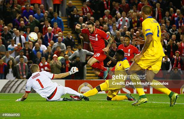 Danny Ings of Liverpool is tackled by Pa Modou Jagne of FC Sion during the UEFA Europa League group B match between Liverpool FC and FC Sion at...