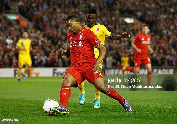 Jordon Ibe of Liverpool is closed down by Ebenezer Assifuah of FC Sion during the UEFA Europa League group B match between Liverpool FC and FC Sion...