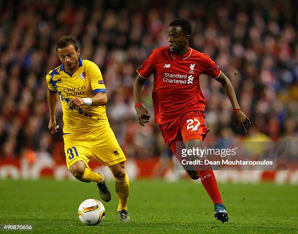 Divock Origi of Liverpool breaks away from Elsad Zverotic of FC Sion during the UEFA Europa League group B match between Liverpool FC and FC Sion at...