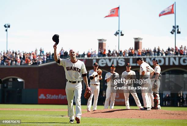 Tim Hudson of the San Francisco Giants waves to the crowd after being taken out of the game in the third inning of their game against the Los Angeles...