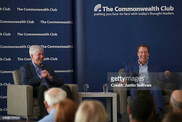 Michigan Governor Rick Snyder and Ford Motor Company Executive Chairman Bill Ford share a laugh at the Commonwealth Club on October 1, 2015 in San...