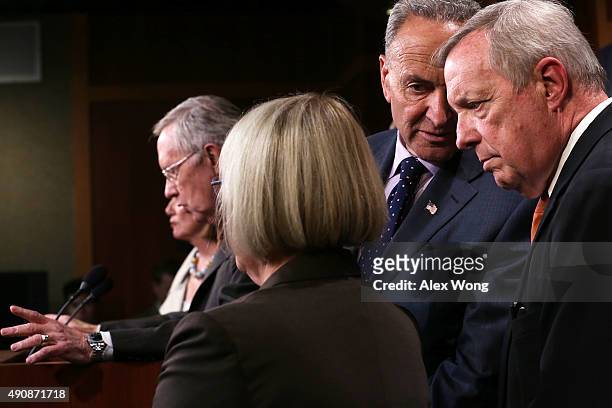 Senate Minority Whip Sen. Richard Durbin listens to Sen. Charles Schumer during a news conference October 1, 2015 at the U.S. Capitol in Washington,...