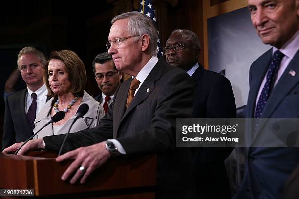 Senate Minority Leader Sen. Harry Reid speaks as Rep. Chris Van Hollen , House Minority Leader Rep. Nancy Pelosi , Rep. Xavier Becerra , Assistant...