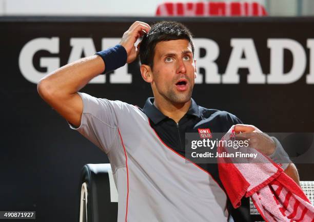 Novak Djokovic of Serbia takes a break in his match against Philipp Kohlshreiber of Germany during day five of the Internazionali BNL d'Italia tennis...