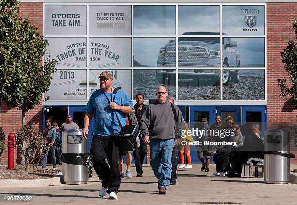 Workers exit during a shift change at the Fiat Chrysler Automobiles NV Warren truck assembly plant in Warren, Michigan, U.S., on Thursday, Oct. 1,...