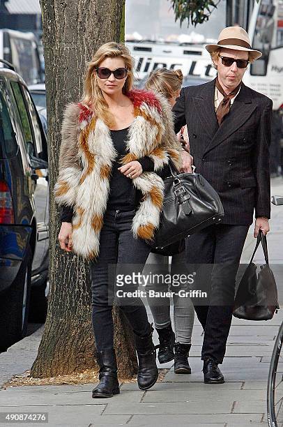Kate Moss and James Brown are seen on March 15, 2011 in London, United Kingdom.