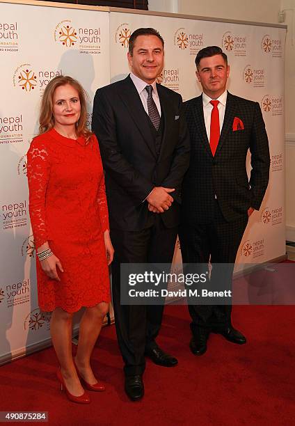 Gina Parker, David Walliams and Simon Russell attend a fundraising event in aid of the Nepal Youth Foundation hosted by David Walliams at Banqueting...
