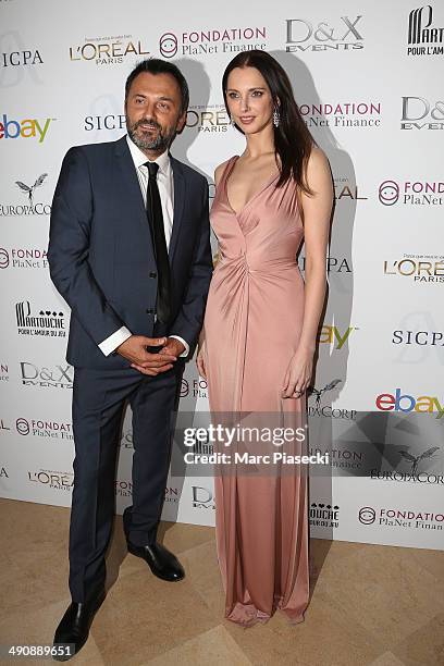 Actress Frederique Bel and Frederic Lopez attend the Planet Finance Foundation Gala Dinner photocall at the 67th Annual Cannes Film Festival on May...