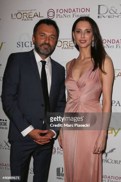 Actress Frederique Bel and Frederic Lopez attend the Planet Finance Foundation Gala Dinner photocall at the 67th Annual Cannes Film Festival on May...
