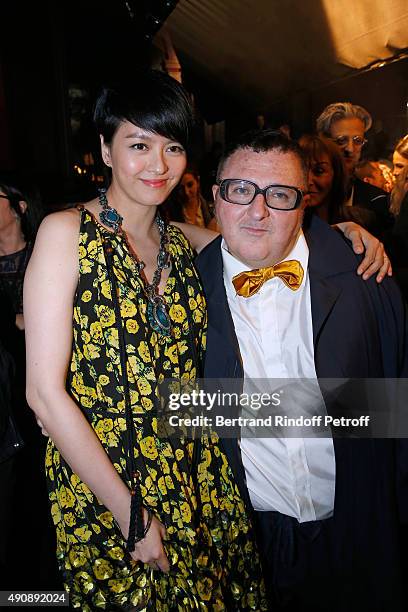 Singer Gigi Leung and Fashion Designer Alber Elbaz pose after the Lanvin show as part of the Paris Fashion Week Womenswear Spring/Summer 2016 on...