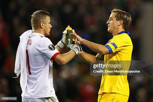 Andris Vanins embraces Reto Ziegler of FC Sion after the UEFA Europa League group B match between Liverpool FC and FC Sion at Anfield on October 1,...