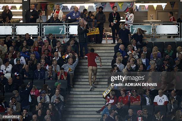 Streaker runs up stairs after going on the pitch during a Pool D match of the 2015 Rugby World Cup between France and Canada at Stadium MK in Milton...