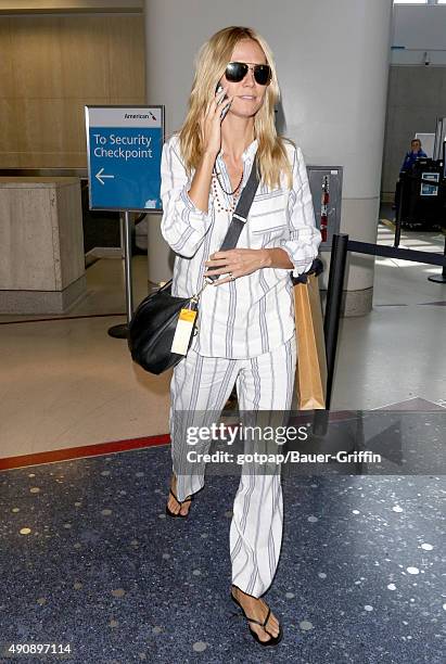 Heidi Klum is seen at LAX on October 01, 2015 in Los Angeles, California.