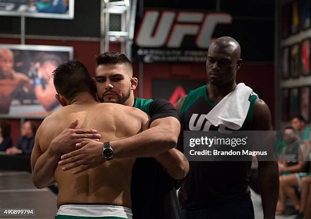 Hector Aldana hugs his head coach Kelvin Gastelum before entering the Octagon before facing Alvaro Herrera during the filming of The Ultimate Fighter...