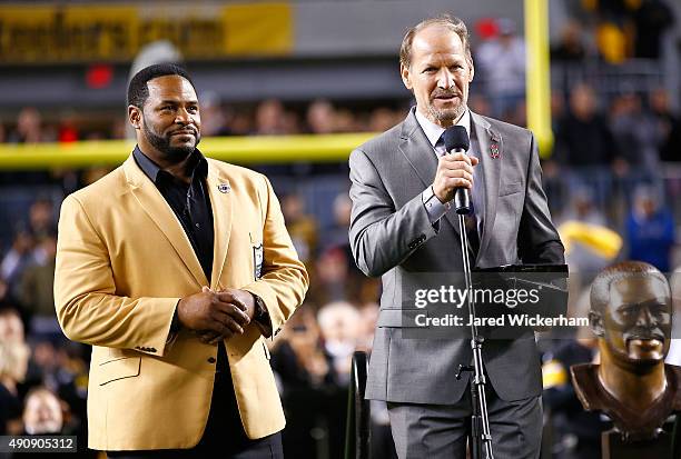 Jerome Bettis is introduced by Bill Cowher during the presentation of his Hall of Fame ring at halftime of the game between the Pittsburgh Steelers...