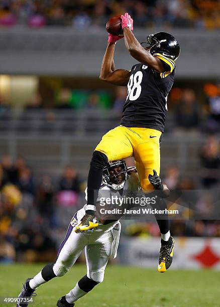 Lardarius Webb of the Baltimore Ravens tackles Darrius Heyward-Bey of the Pittsburgh Steelers after making a catch in the 4th quarter of the game at...