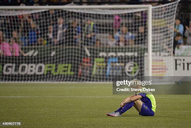 Megan Rapinoe of Seattle Reign FC sits on the pitch after the Seattle Reign FC lost the NWSL Championship to the FC Kansas City by a score of 1-0 at...